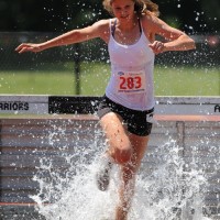 steeple OO 400x500 Chloe Williams enjoys the refreshing water, while setting a new Liberty Tour and Adirondack Championship record in the Young Women's 2000m Steeplechase with a time of 8:43.15.