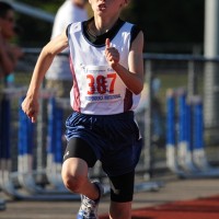 Preparing for an earned trip to the Natuional Junior Olympics in Sacramento, CA, Country Mills Eagles star, Mitch Flanger sets a Midget Boy's 100m Dash record with a time of 14.38. He also set a meet record in the Midget Boy's 800m run with a time of 2:35.48.