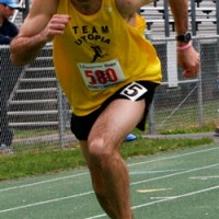 Justin Bishop makes a quick break in the Open Men's 3000m Run, then set the new record in that event with a time of 9:17.21.  Not satisfied with that, he also set a new record in the Open Men's 1500m Run with a crisp 4:19.28.